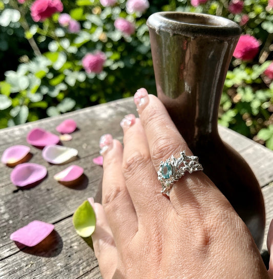 The natural Cambodia blue zircon ring in solid Sterling silver. ocean inspired contemporary engagement ring.