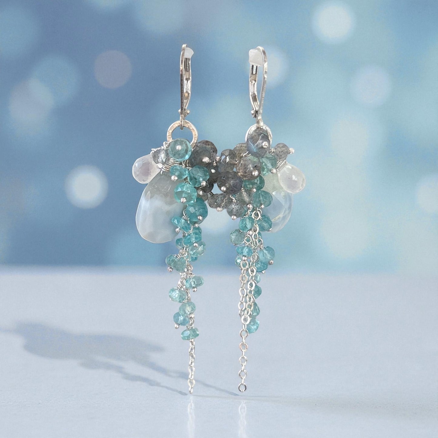 Winter wonderland earring with blue opal, teal apatite, labradorite. Snowy winter outfits for holiday season