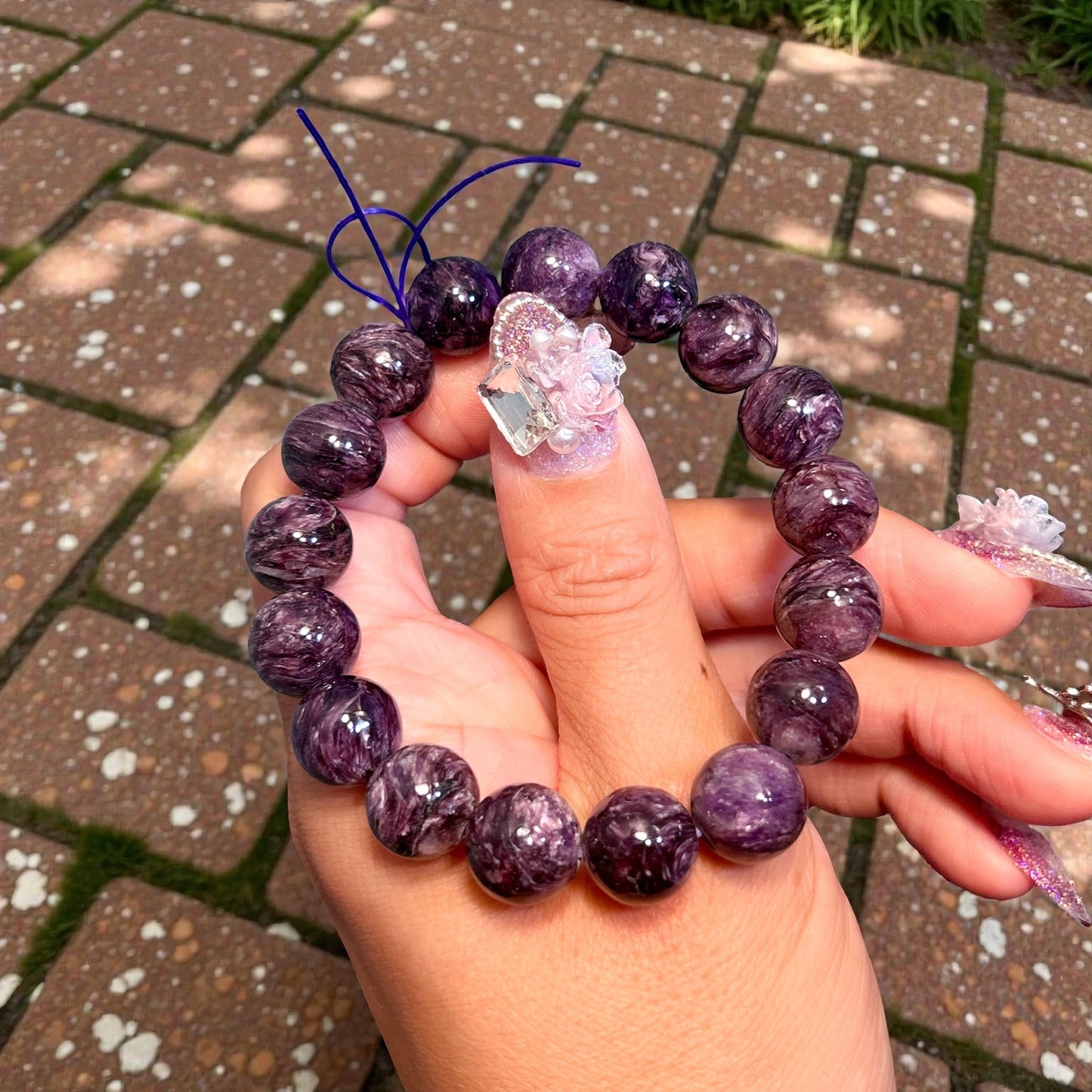 All natural purple charoite, no treatment or encouragement.  charoite with less to no black veins